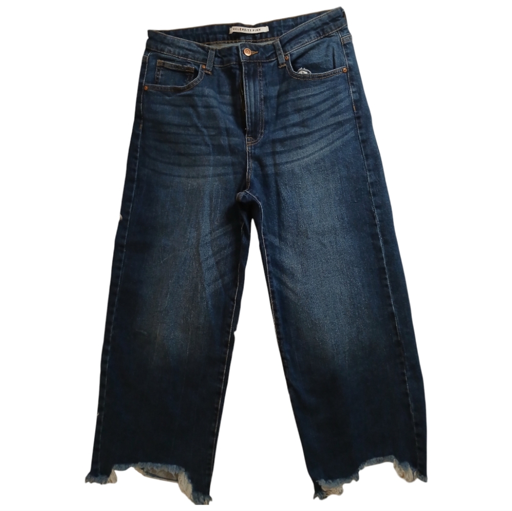 Women's wide legged ankle pants with distressed tassels around the ankle